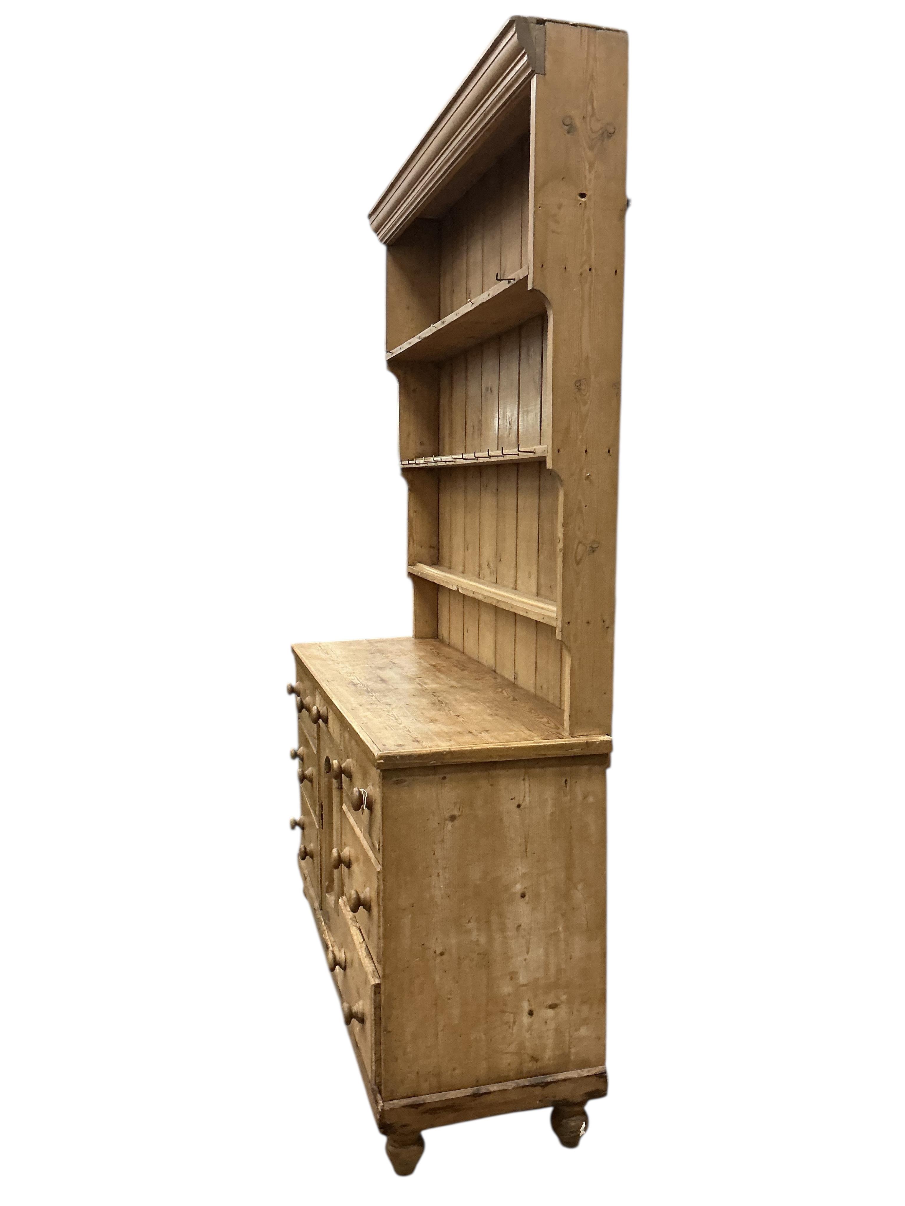 A Victorian pine dresser with boarded rack, width 148cm, depth 48cm, height 224cm